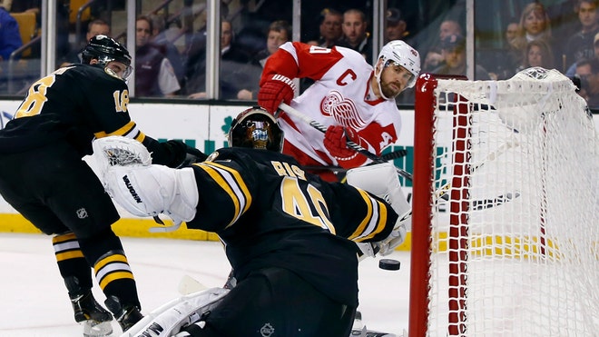  Stephen Weiss and Daniel Cleary scored second-period goals, reserve goaltender Jonas Gustavsson made  saves in his first action of the season and the Detroit Red Wings edged the Boston Bruins - Monday.